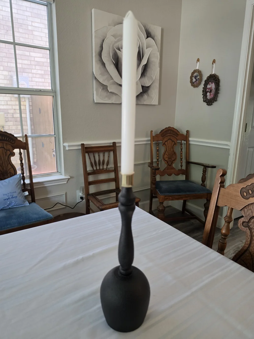 Black and gold taper candlestick holder Bulbous base Sleek turned spindle neck